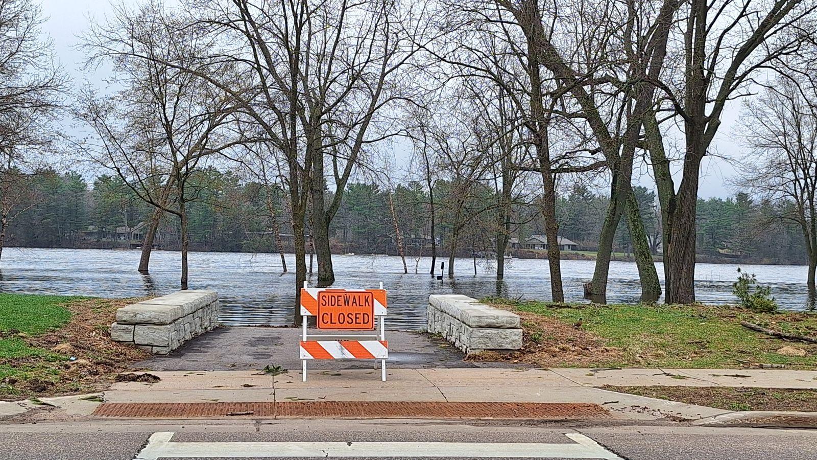 Wisconsin River is running over its banks in Wisconsin Rapids
